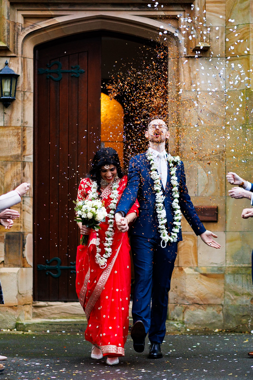 Bride and Groom in confetti at Mold Registry Office North Wales