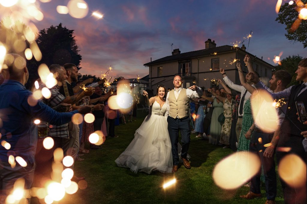 Highfield hall wedding photography Bride and groom in a sparkler exit at Highfield Hall North Wales