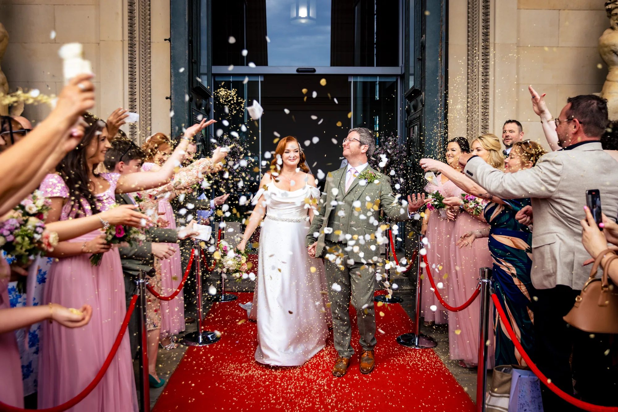 Newlyweds leaving St George's Hall Liverpool through confetti